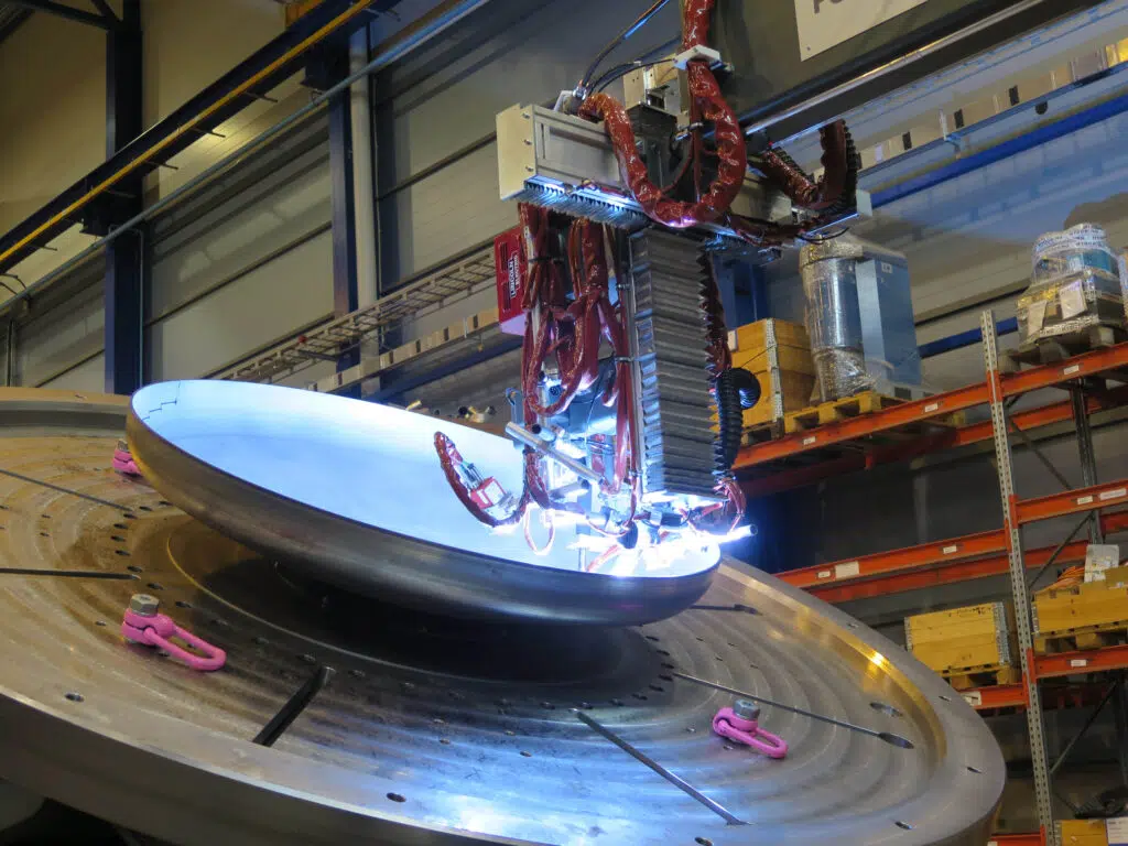Dish end cladding and welding with PEMA solumn and boom system and a welding positioner.