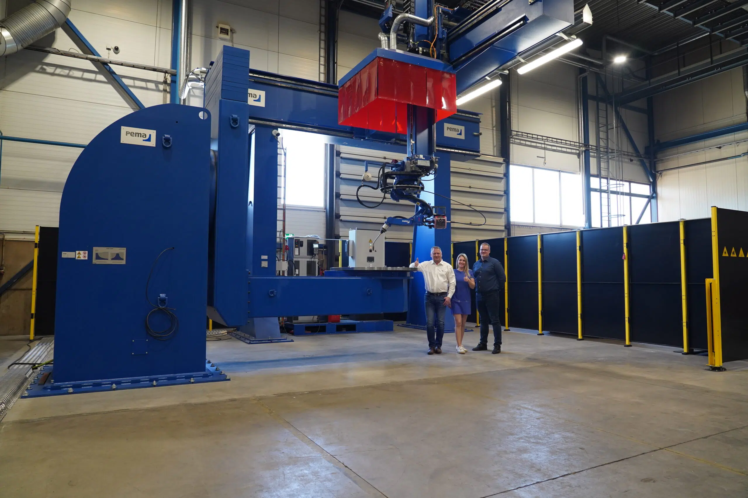 PEMA robotic welding station for customer Harry Metall in Estonia. Picture of the machine and the team.